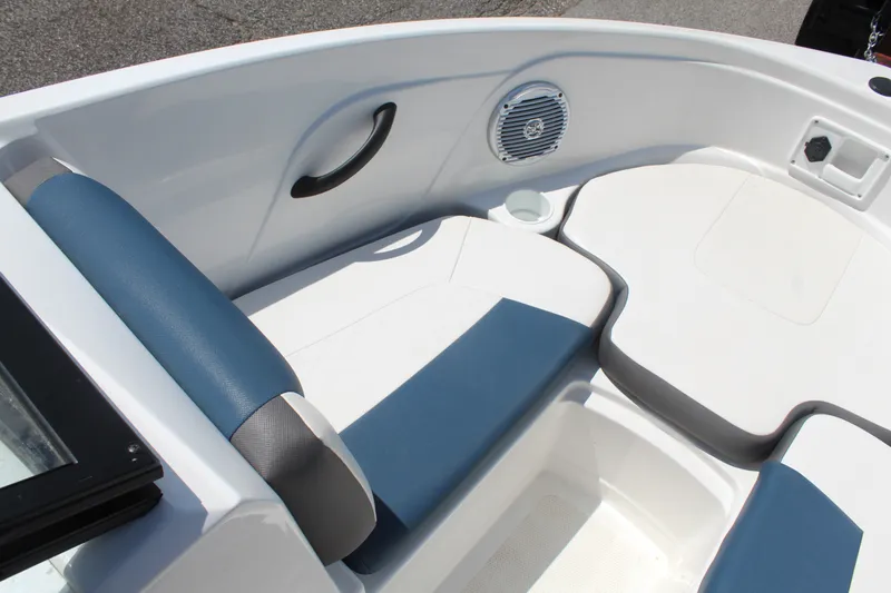 Slide: The Image of The image shows the seating area of a 2022 Tracker Tahoe 185S boat with blue upholstery. - 16