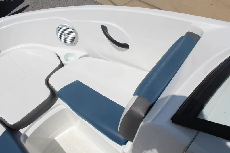 Slide: The Image of The image shows the seating area of a 2022 Tracker Tahoe 185S boat with blue and white upholstery. - 17
