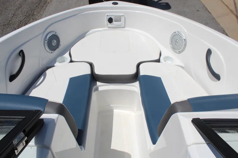 Slide: The Image of The image shows the bow of a 2022 Tracker Tahoe 185S boat with blue and white seating. - 15