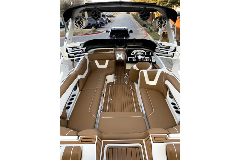 Slide: The Image of Luxurious interior of 2021 MB F24 Tomcat Alpha boat with brown seating and modern dashboard. - 9