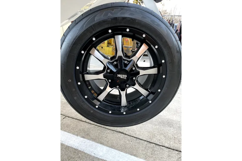 Slide: The Image of Black alloy wheel of 2021 MB F24 Tomcat Alpha on concrete surface. - 17