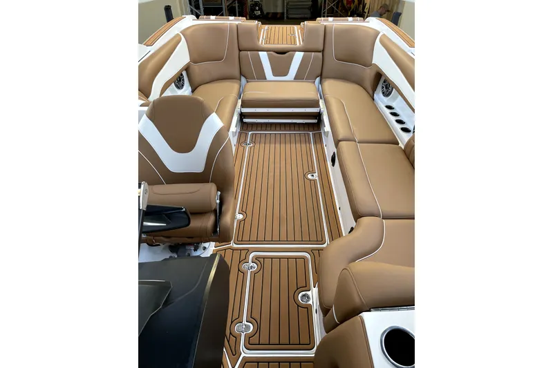 Slide: The Image of Luxurious interior of 2021 MB F24 Tomcat Alpha boat with tan seating and wood-style flooring. - 10