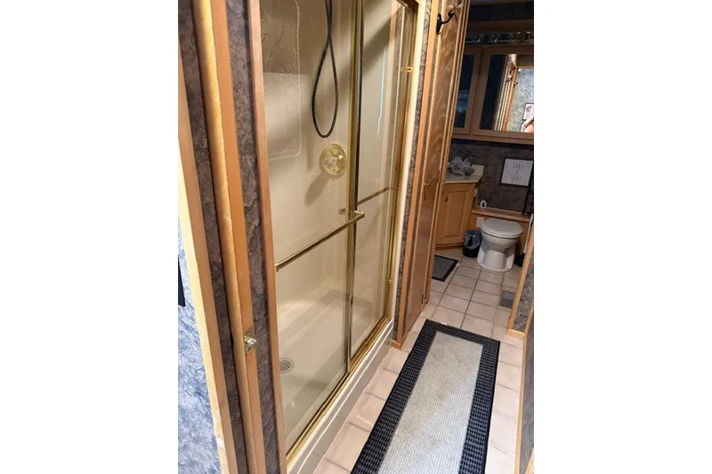 Slide: The Image of Bathroom interior of 1995 Stardust Cruisers 18 x 65 houseboat with shower and toilet. - 20