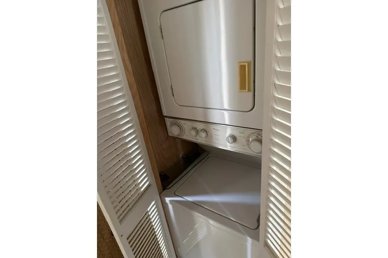 Slide: The Image of Stacked washer and dryer in 1995 Stardust Cruisers 18 x 65 houseboat. - 26