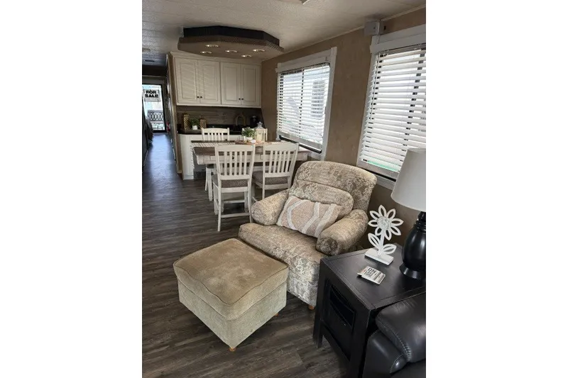 Slide: The Image of Cozy interior of a 1995 Stardust Cruisers 18 x 65 houseboat with seating and dining area. - 14