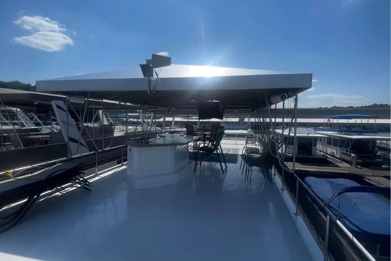 Slide: The Image of 1995 Stardust Cruisers 18 x 65 houseboat with spacious upper deck and seating area. - 32