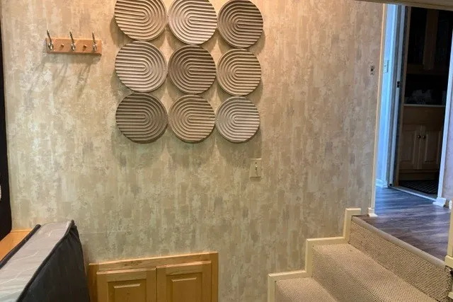 Slide: The Image of Interior of 1995 Stardust Cruisers houseboat with decorative wall art and carpeted stairs. - 30