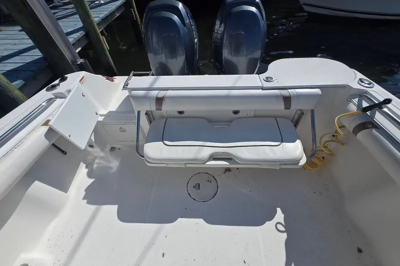 Slide: The Image of 2004 Wellcraft 252 Coastal boat interior with seating and dual engines visible. - 8