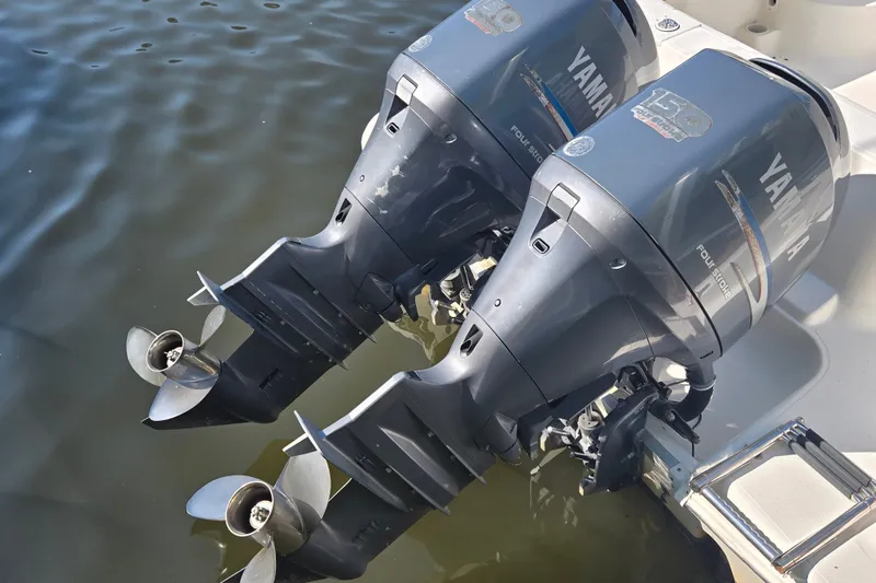 Slide: The Image of Twin Yamaha outboard motors on a 2004 Wellcraft 252 Coastal boat. - 6