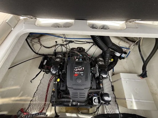 Slide: The Image of The engine compartment of a 2007 Larson LXi 268 featuring a Mercury 350 MAG MPI engine. - 23