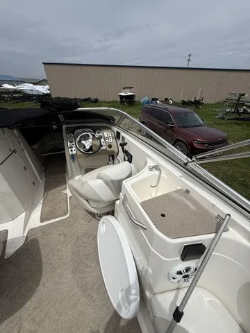 Slide: The Image of The image shows the cockpit of a 2007 Larson LXi 268 with a helm and small sink. - 21