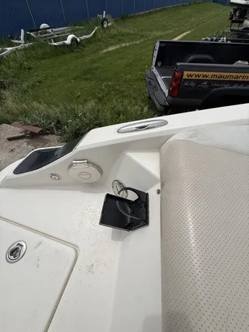 Slide: The Image of The image shows the stern of a boat with a cushioned seat and a cup holder. - 30