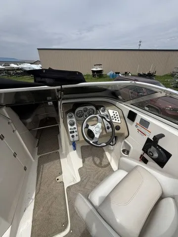 Slide: The Image of The image shows the cockpit of a 2007 Larson LXi 268 boat with a modern helm. - 17