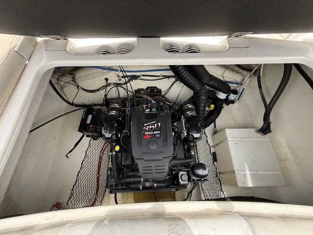 Slide: The Image of The engine compartment of a 2007 Larson LXi 268 featuring a Mercury 350 MAG MPI engine. - 22