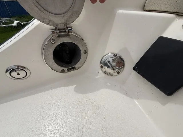 Slide: The Image of Close-up of a boat deck with a fuel cap and cover. - 31