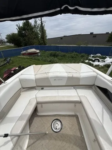 Slide: The Image of The image shows the cockpit of a 2007 Larson LXi 268 with white upholstery. - 24