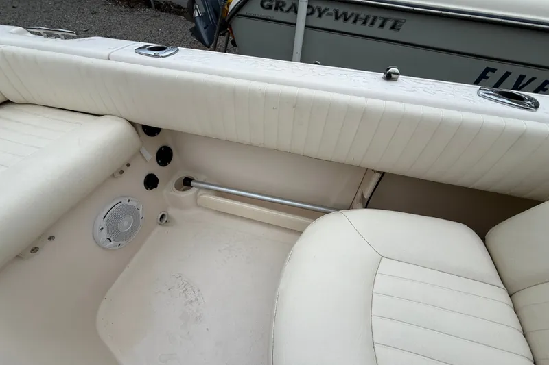Slide: The Image of 2007 Grady-White Tournament 205 boat interior with white seating and speaker. - 29