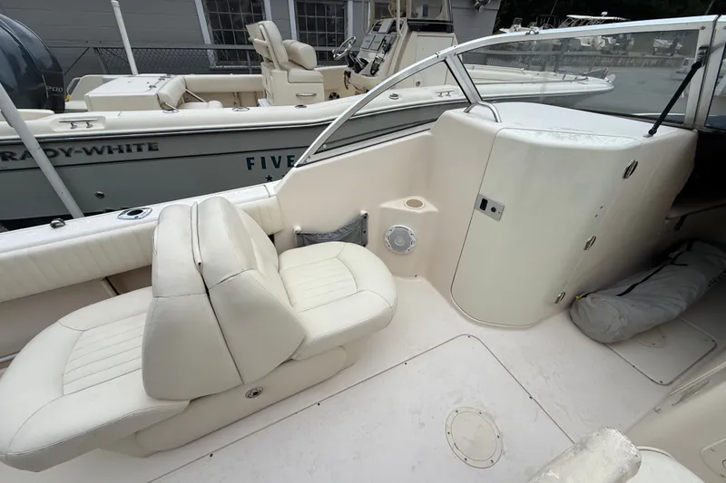 Slide: The Image of 2007 Grady-White Tournament 205 boat interior with white seating and dashboard. - 18