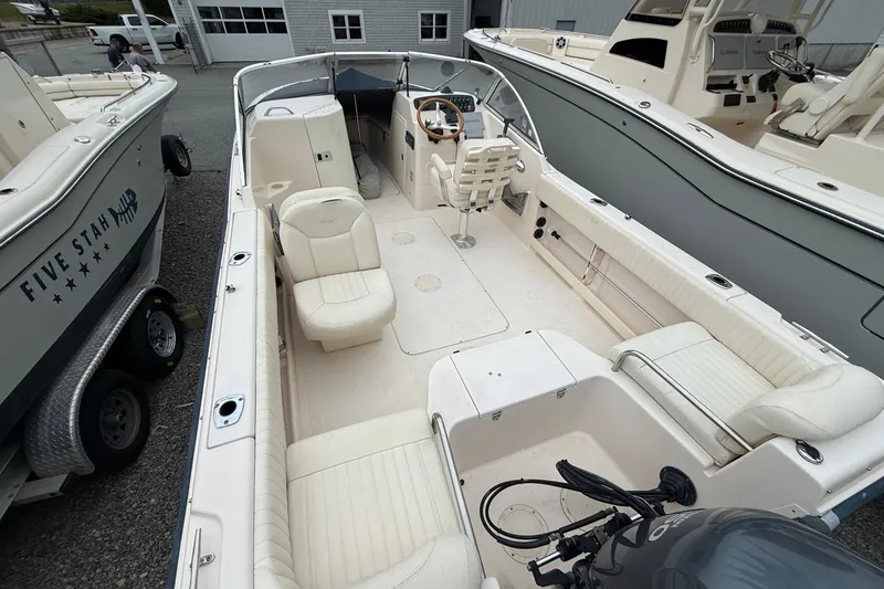 Slide: The Image of 2007 Grady-White Tournament 205 boat interior with seating and steering console. - 10