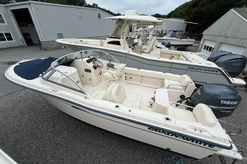 Slide: The Image of 2007 Grady-White Tournament 205 boat with Yamaha engine, docked at a marina. - 2