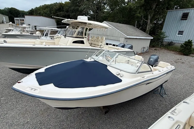 The Image of 2007 Grady-White Tournament 205 boat with cover, parked in a marina. - 1