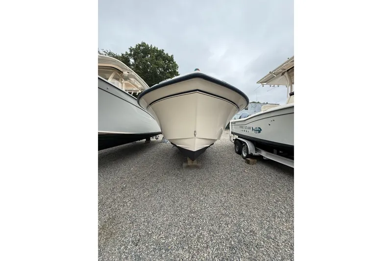 Slide: The Image of 2007 Grady-White Tournament 205 boat on gravel lot, front view. - 3