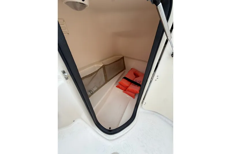 Slide: The Image of Storage compartment of 2007 Grady-White Tournament 205 boat with life jackets. - 15