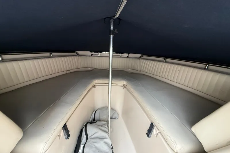 Slide: The Image of 2007 Grady-White Tournament 205 boat interior with cushioned seating and storage. - 19