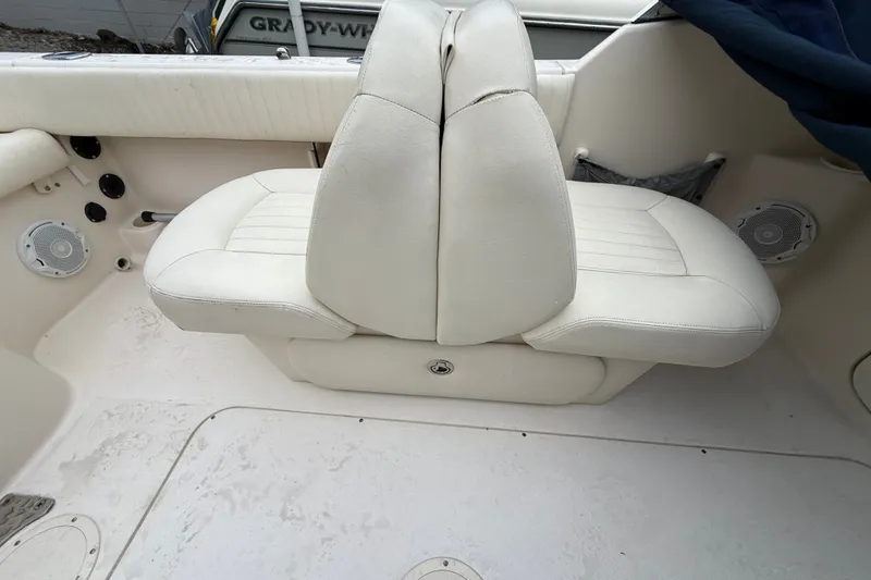 Slide: The Image of 2007 Grady-White Tournament 205 boat interior with white seating and speakers. - 31
