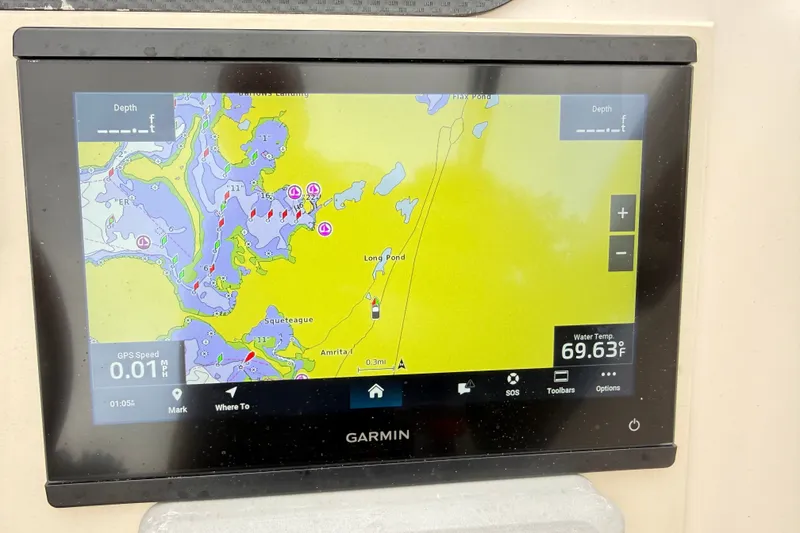 Slide: The Image of Garmin GPS display on 2007 Grady-White Tournament 205 boat, showing navigation map and water temperature. - 26