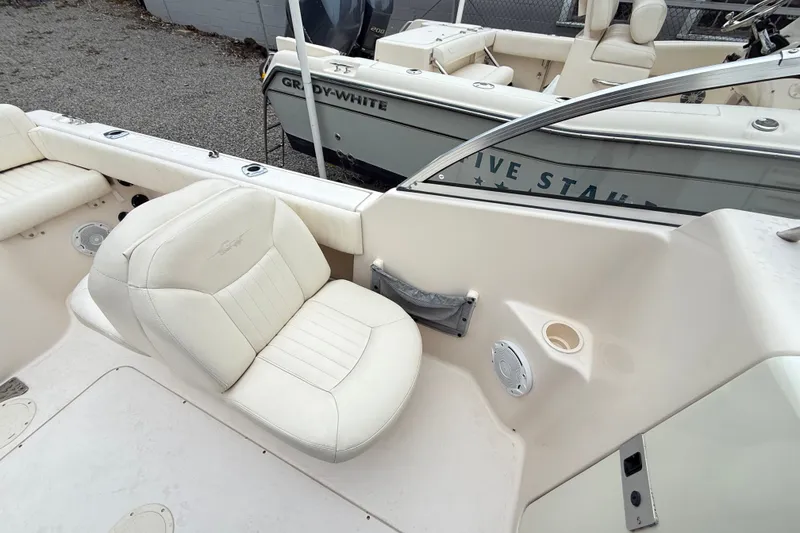 Slide: The Image of 2007 Grady-White Tournament 205 boat interior with white seating and console details. - 21
