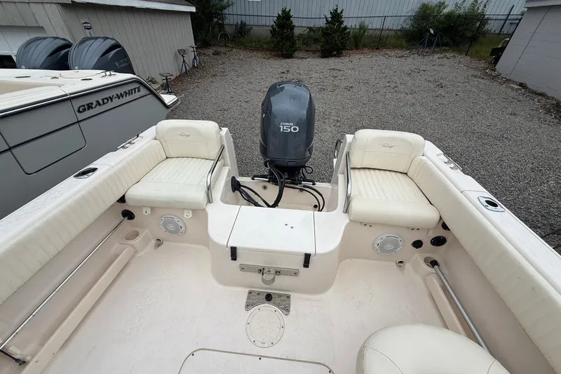 Slide: The Image of 2007 Grady-White Tournament 205 boat interior with Yamaha 150 engine, white seating. - 16
