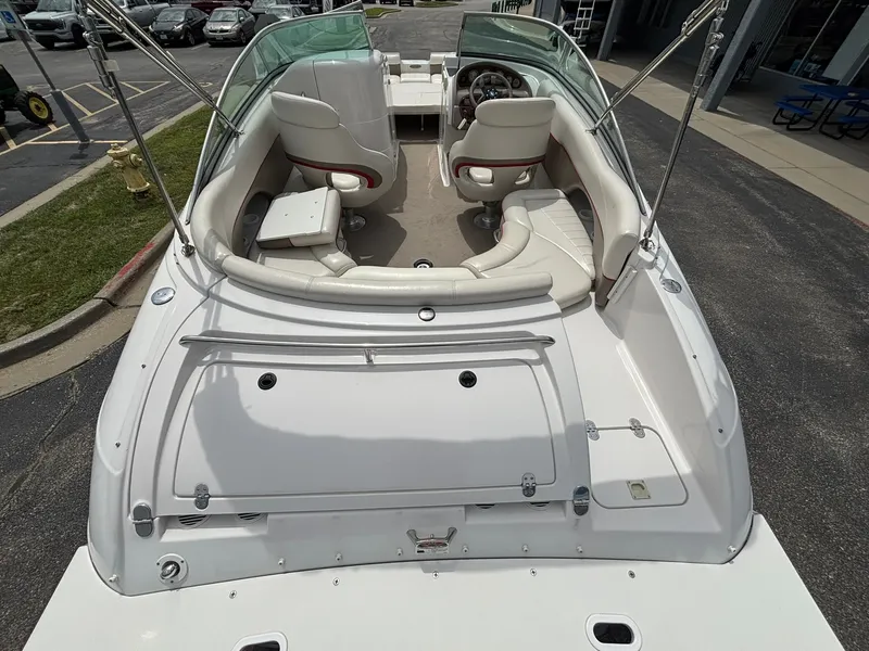 Slide: The Image of The image shows a 2003 Four Winns 214 Fun Ship with white interior and dual helm seats. - 14
