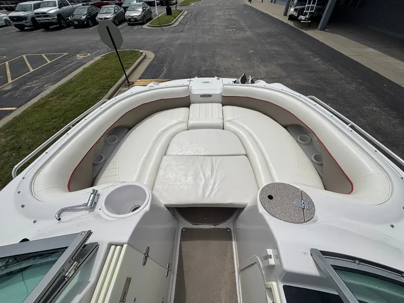 Slide: The Image of The image shows the bow area of a 2003 Four Winns 214 Fun Ship with white upholstery. - 29