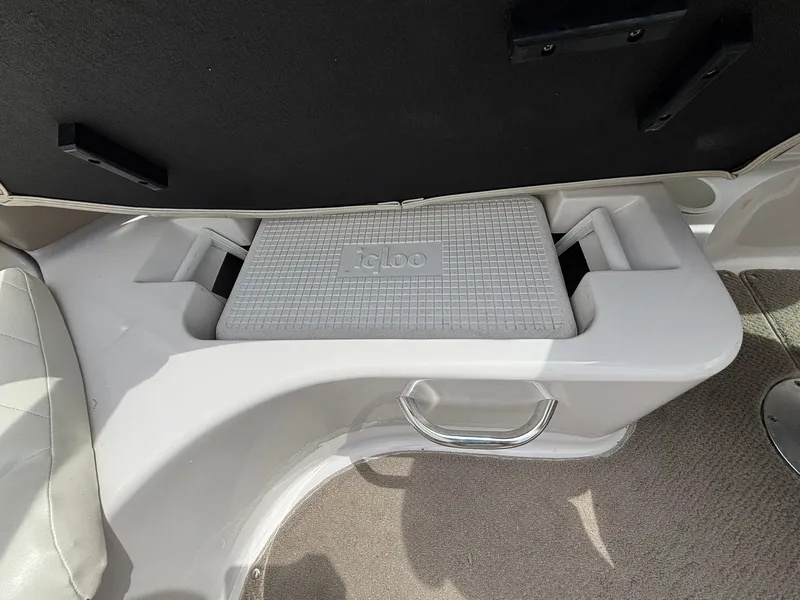 Slide: The Image of A built-in storage compartment with an Igloo cooler inside a boat. - 20