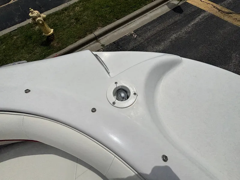 Slide: The Image of The image shows the deck of a 2003 Four Winns 214 Fun Ship with a round hatch. - 36