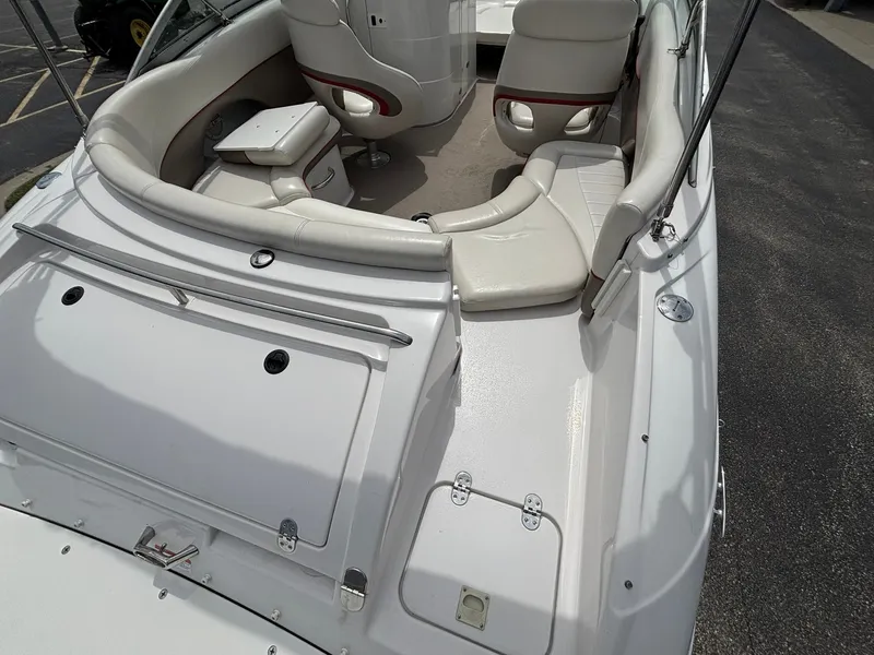 Slide: The Image of The image shows the cockpit of a 2003 Four Winns 214 Fun Ship with white upholstery. - 17