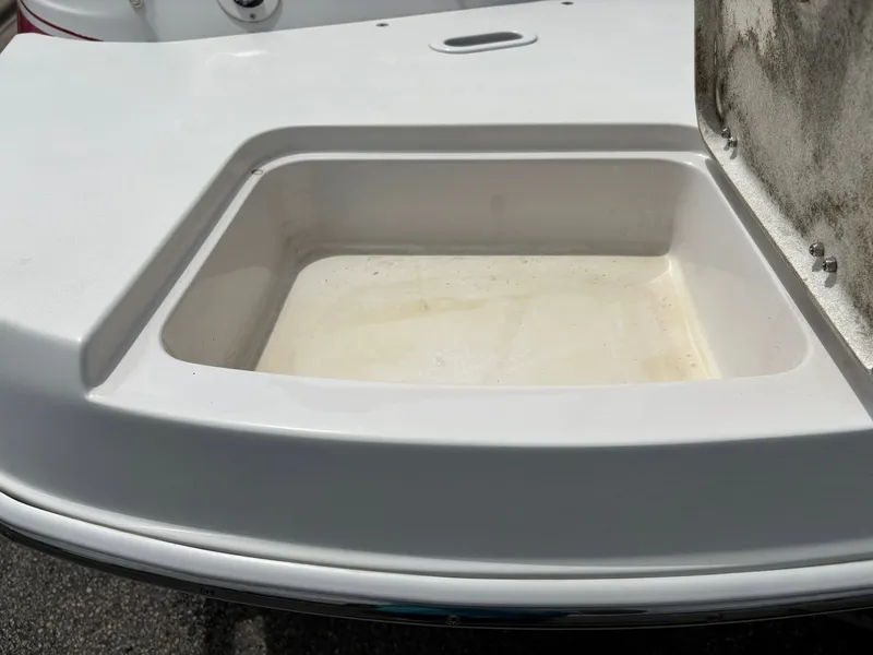 Slide: The Image of A white boat with a built-in rectangular compartment on the deck. - 8