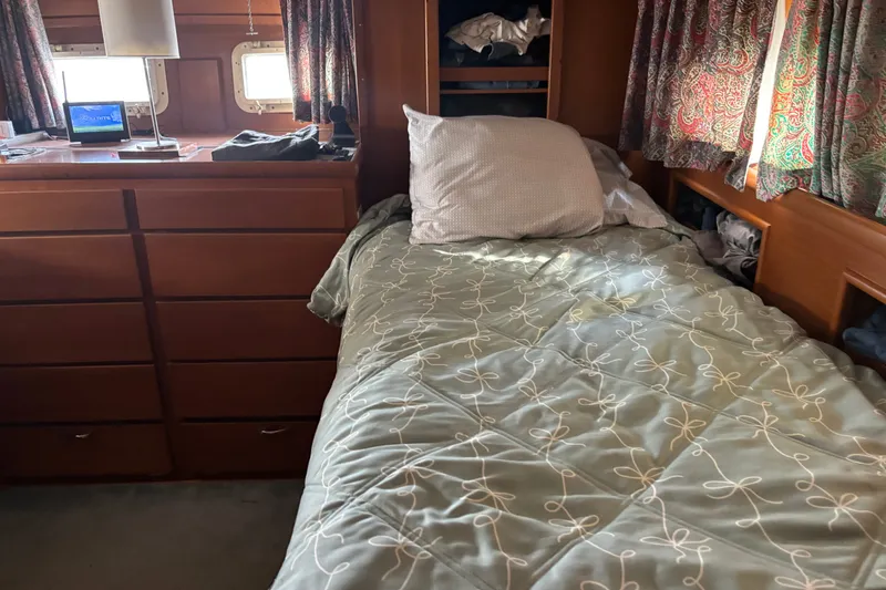 Slide: The Image of Cozy cabin interior of 1969 Hatteras 38 Double Cabin with bed and wooden furnishings. - 25
