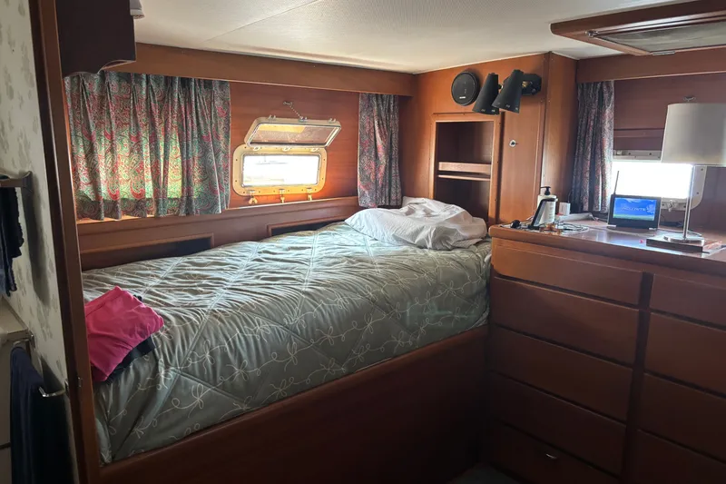 Slide: The Image of Cozy cabin interior of 1969 Hatteras 38 Double Cabin with bed and wooden furnishings. - 24