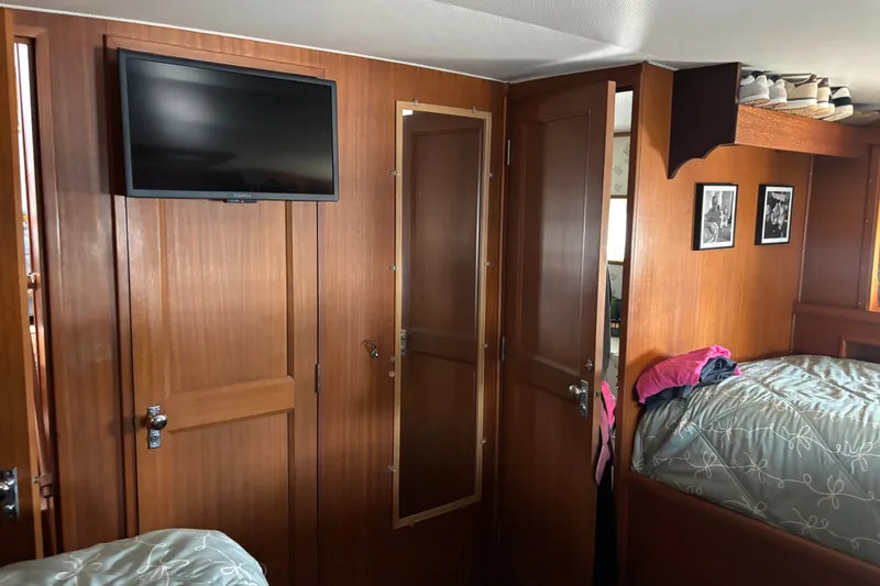 Slide: The Image of Interior of 1969 Hatteras 38 Double Cabin with wood paneling and mounted TV. - 31