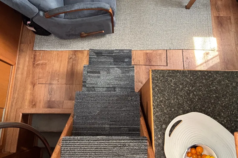 Slide: The Image of Interior of 1969 Hatteras 38 Double Cabin with stairs, chair, and fruit bowl. - 13