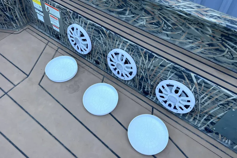 Slide: The Image of Camouflage-patterned Tracker Grizzly 1650 T Prairie Wings Edition boat interior with white speaker covers. - 15