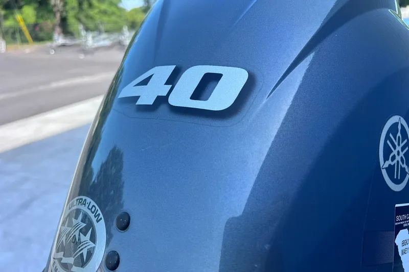 Slide: The Image of Close-up of a 2025 Tracker Grizzly 1650 T Prairie Wings Edition with "40" marking. - 26