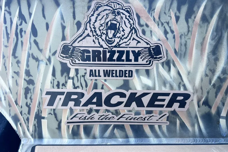 Slide: The Image of Tracker Grizzly 1650 T Prairie Wings Edition 2025 logo with camouflage background. - 22