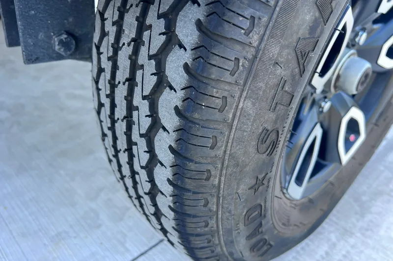 Slide: The Image of Close-up of a tire on a 2025 Tracker Grizzly 1650 T Prairie Wings Edition. - 28