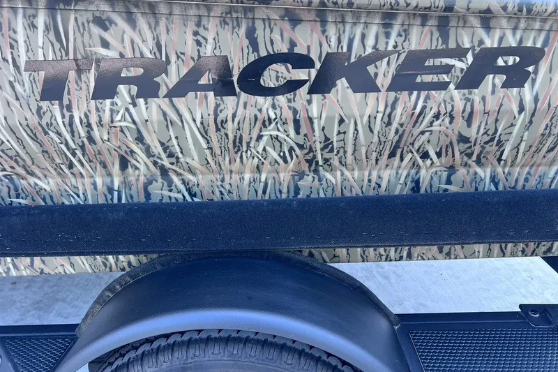 Slide: The Image of 2025 Tracker Grizzly 1650 T Prairie Wings Edition with camouflage design and logo. - 21