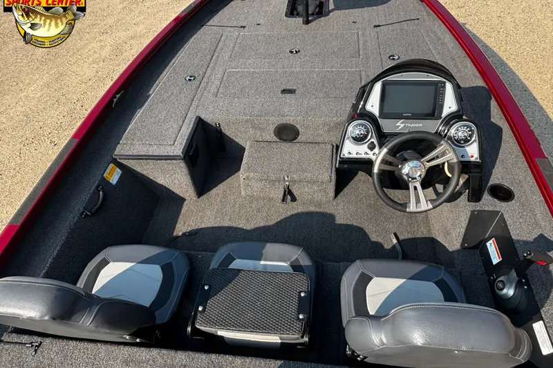 Slide: The Image of 2020 Lowe Stinger 175C boat interior with steering console and seating. - 7