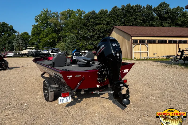 Slide: The Image of 2020 Lowe Stinger 175C boat with Mercury 60 engine, parked outdoors. - 3