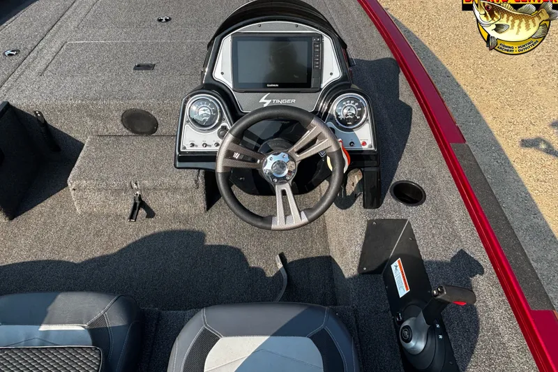 Slide: The Image of 2020 Lowe Stinger 175C boat dashboard with steering wheel and control panel. - 6